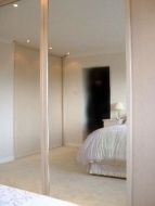 Plain mirror and panel pearwood doors